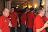 The staff behind the lager bar dispense beer at a record breaking pace during the busiest time on the Friday evening.