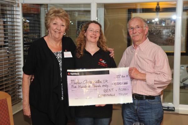 Claire Marshall, the beer festival chairperson, and John Taylor, father of Simon Taylor, present a cheque for £500 to Beryl Henshaw of the Marfan's Association.